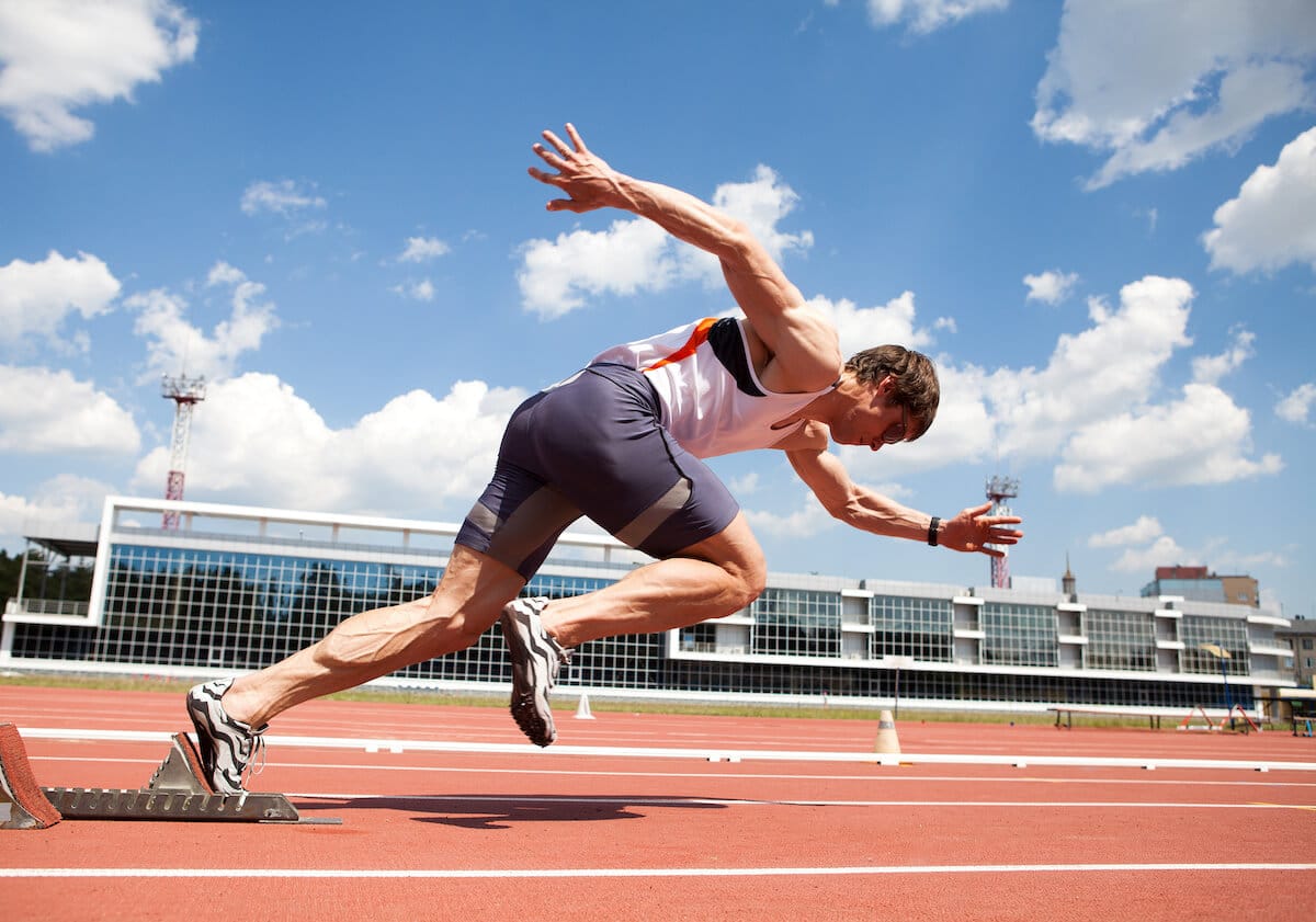 Supplements for athletes: athlete running on a track