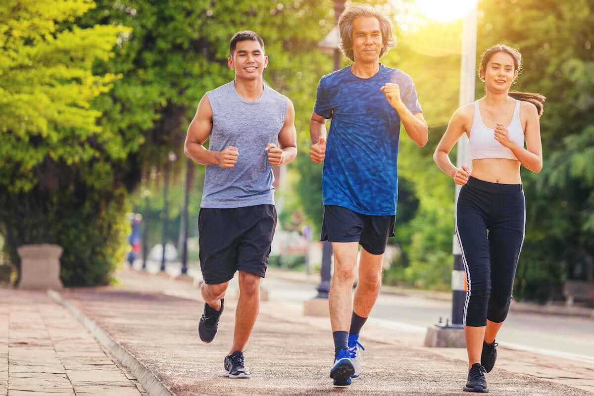 Three people jogging outdoors