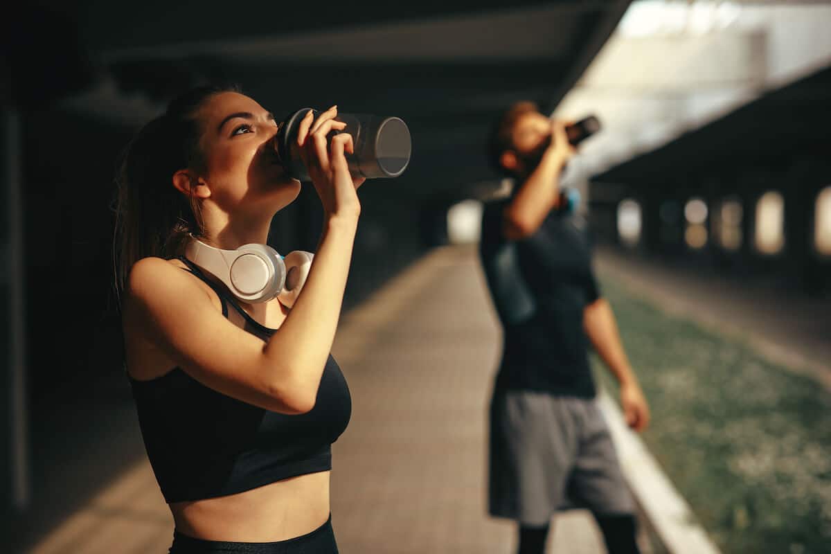 Two people drinking from their tumblers