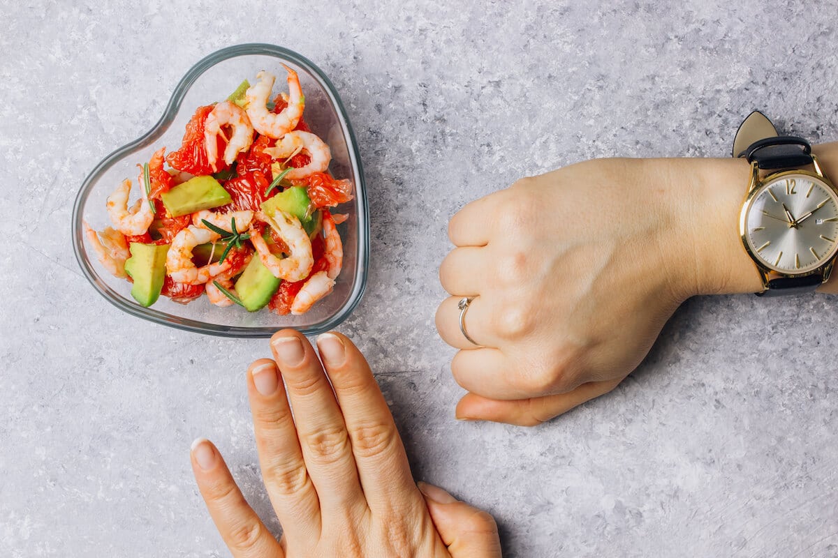 How often should you eat: bowl of food and a wrist watch