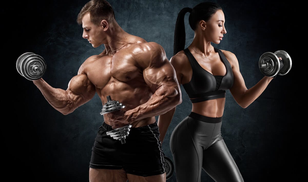 Male and female bodybuilders performing a bulking workout.