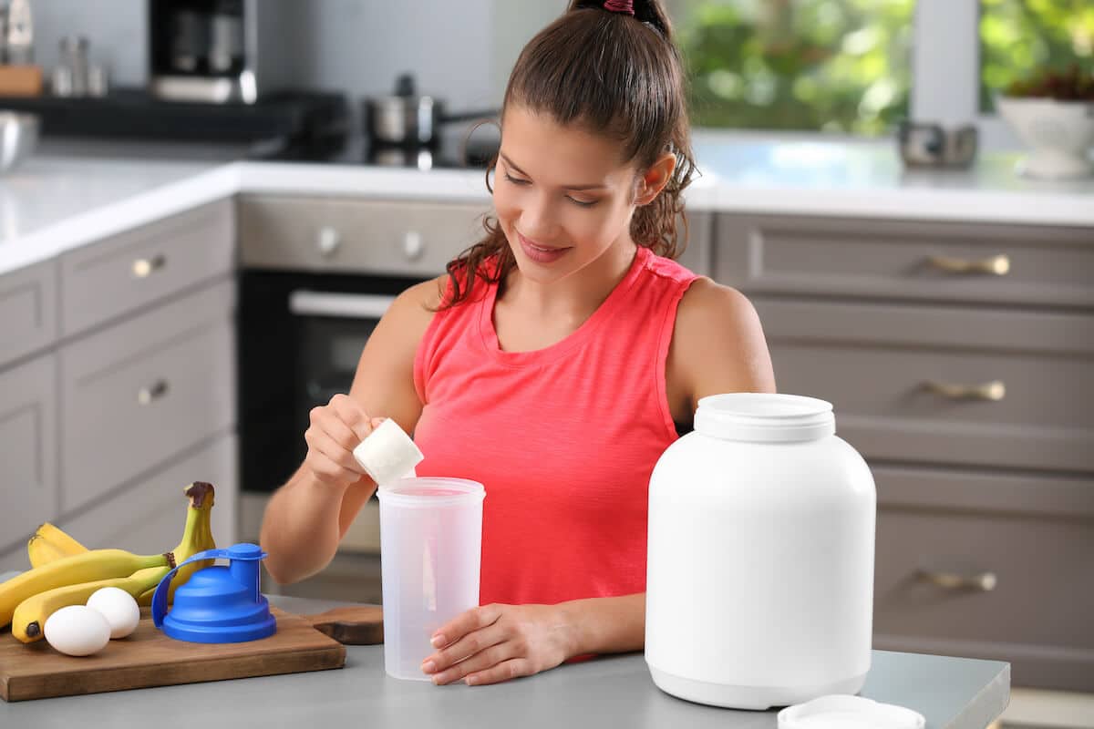 Woman preparing her protein shake