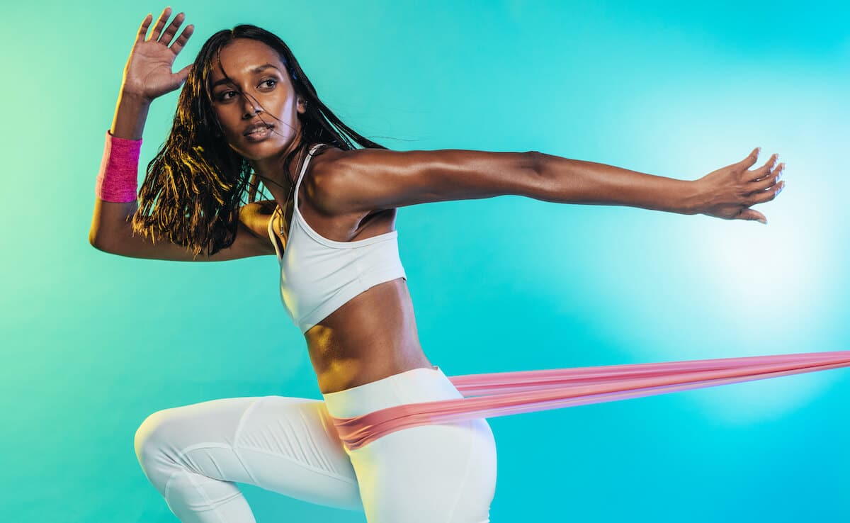 BCAA for women: woman using a resistance band