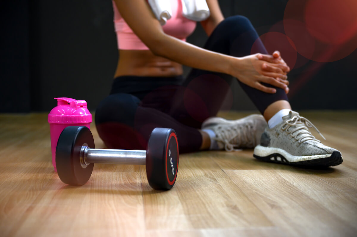 Dumbbell and a pink tumbler