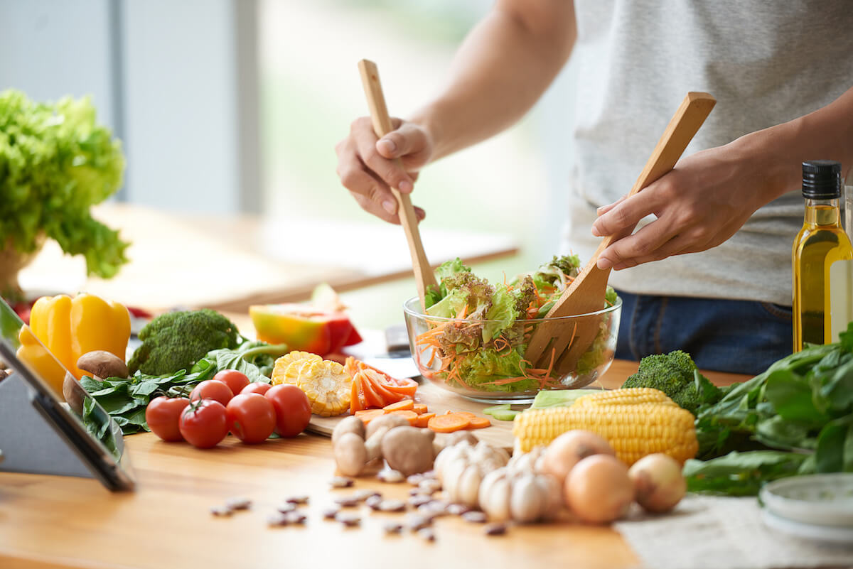 Person making a vegetable salad