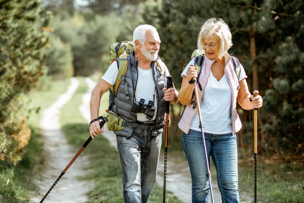 Low intensity cardio: senior couple hiking together