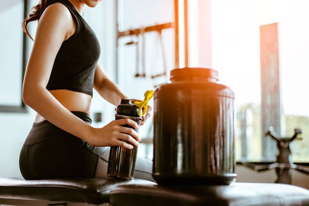 Is pea protein good for you: woman holding a tumbler