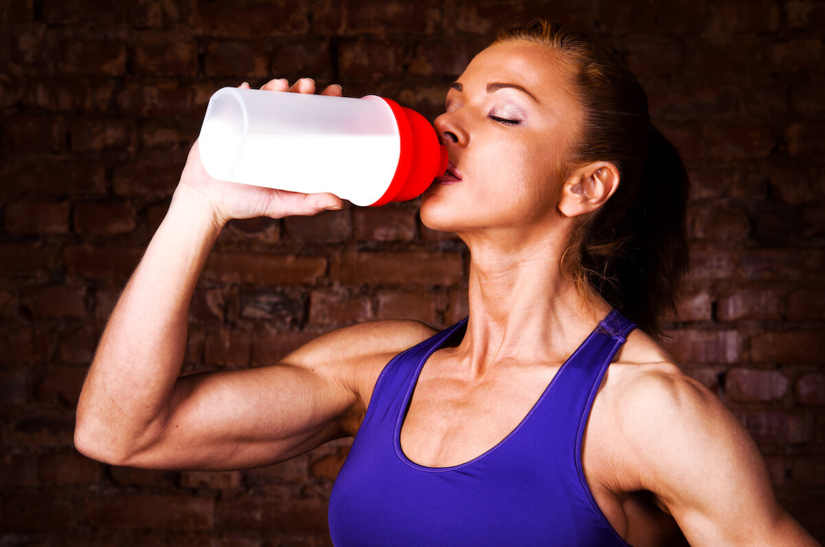 Coach drinking a protein shake