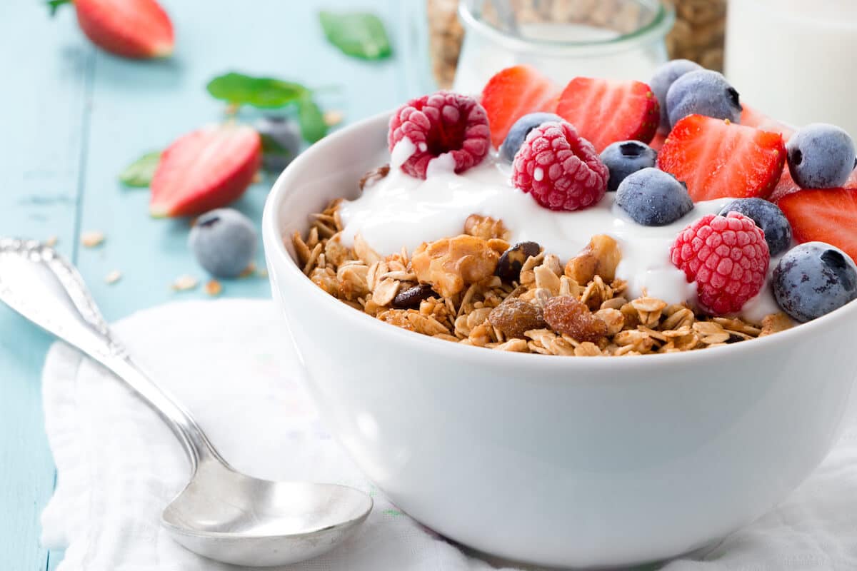 Pre workout meals: granola with yogurt and berries in a bowl