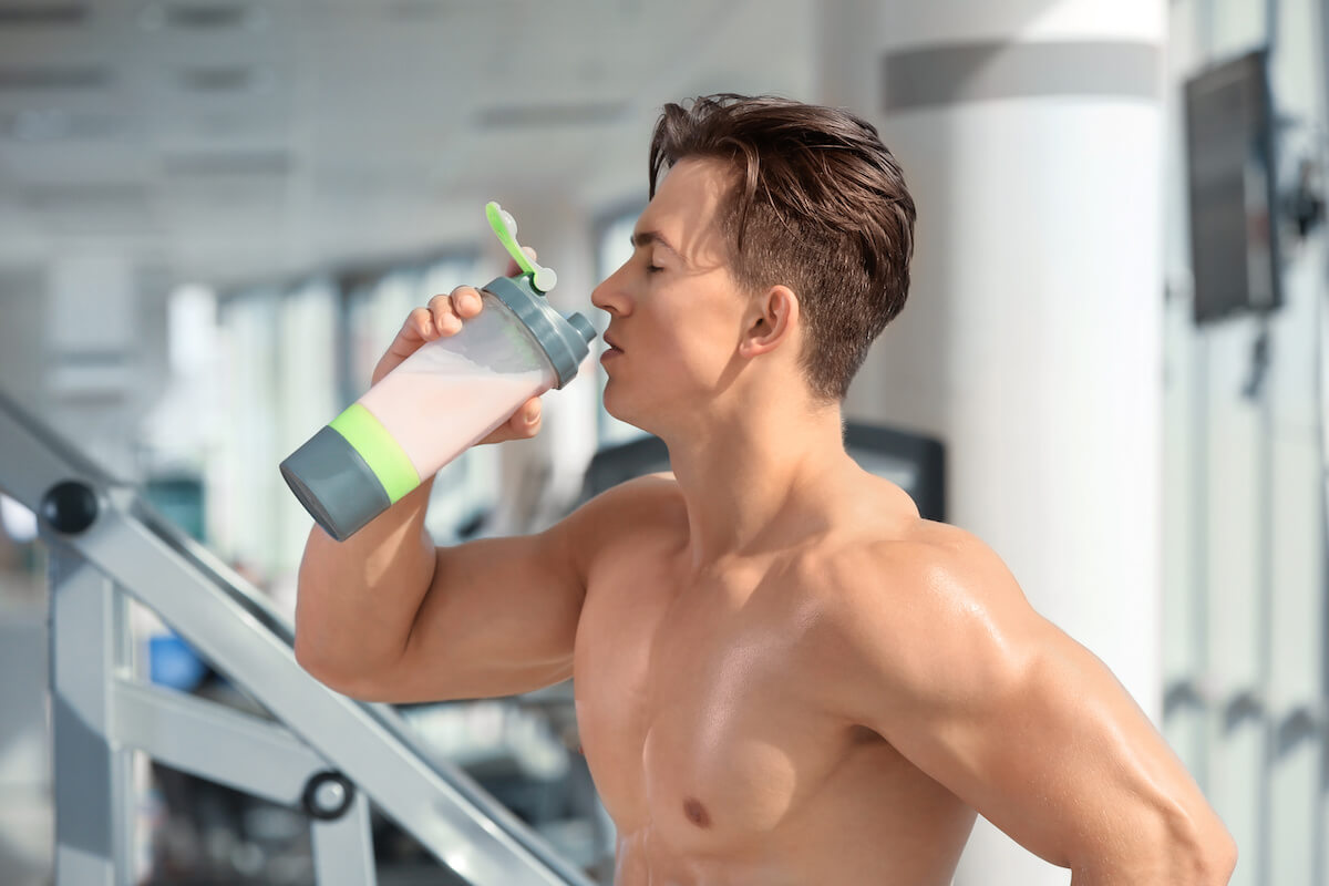 Man drinking his protein shake after working out