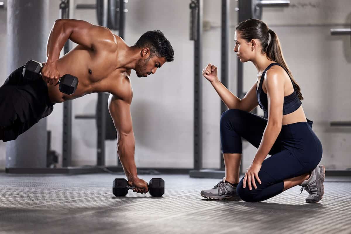 Coach cheering her student while working out