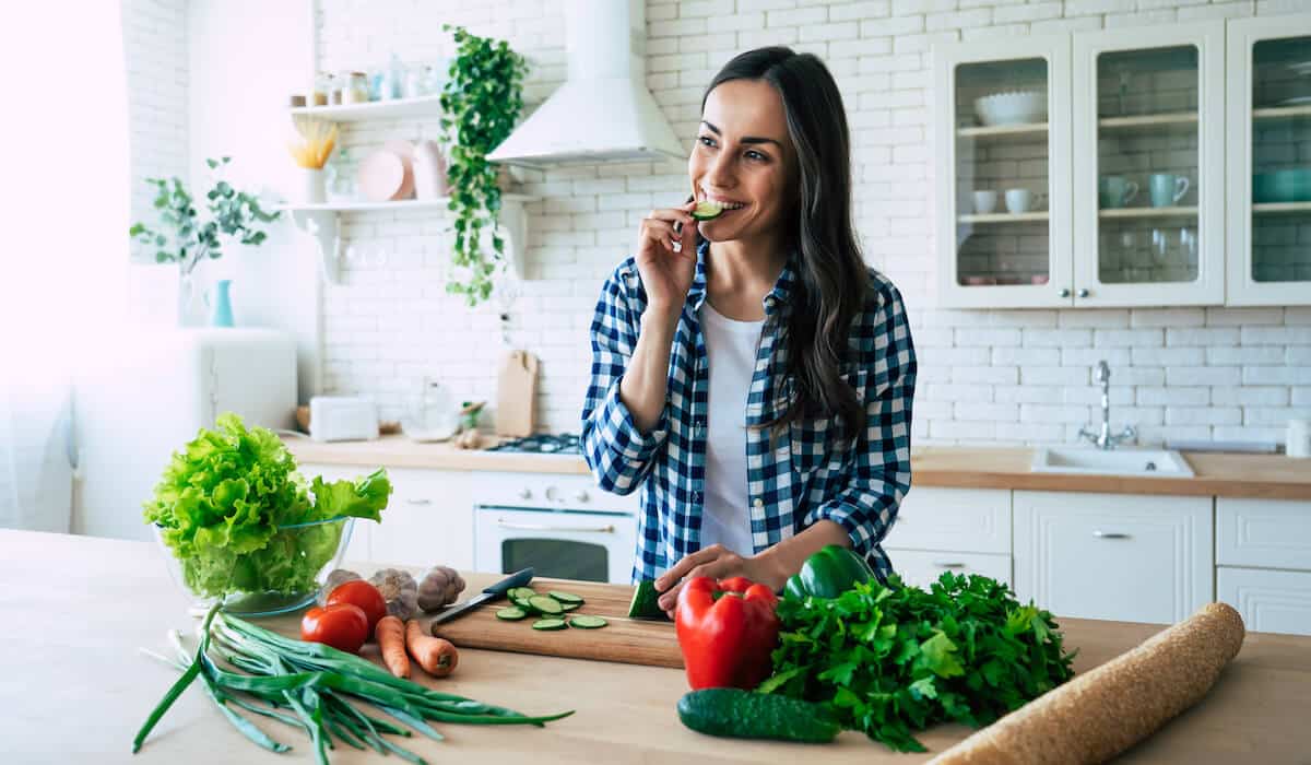 Woman eating some cucumbers