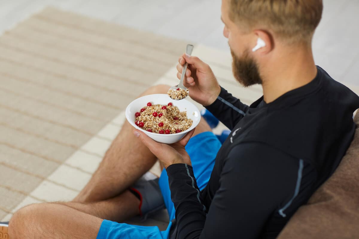 Metabolic confusion: man eating some oatmeal with berries