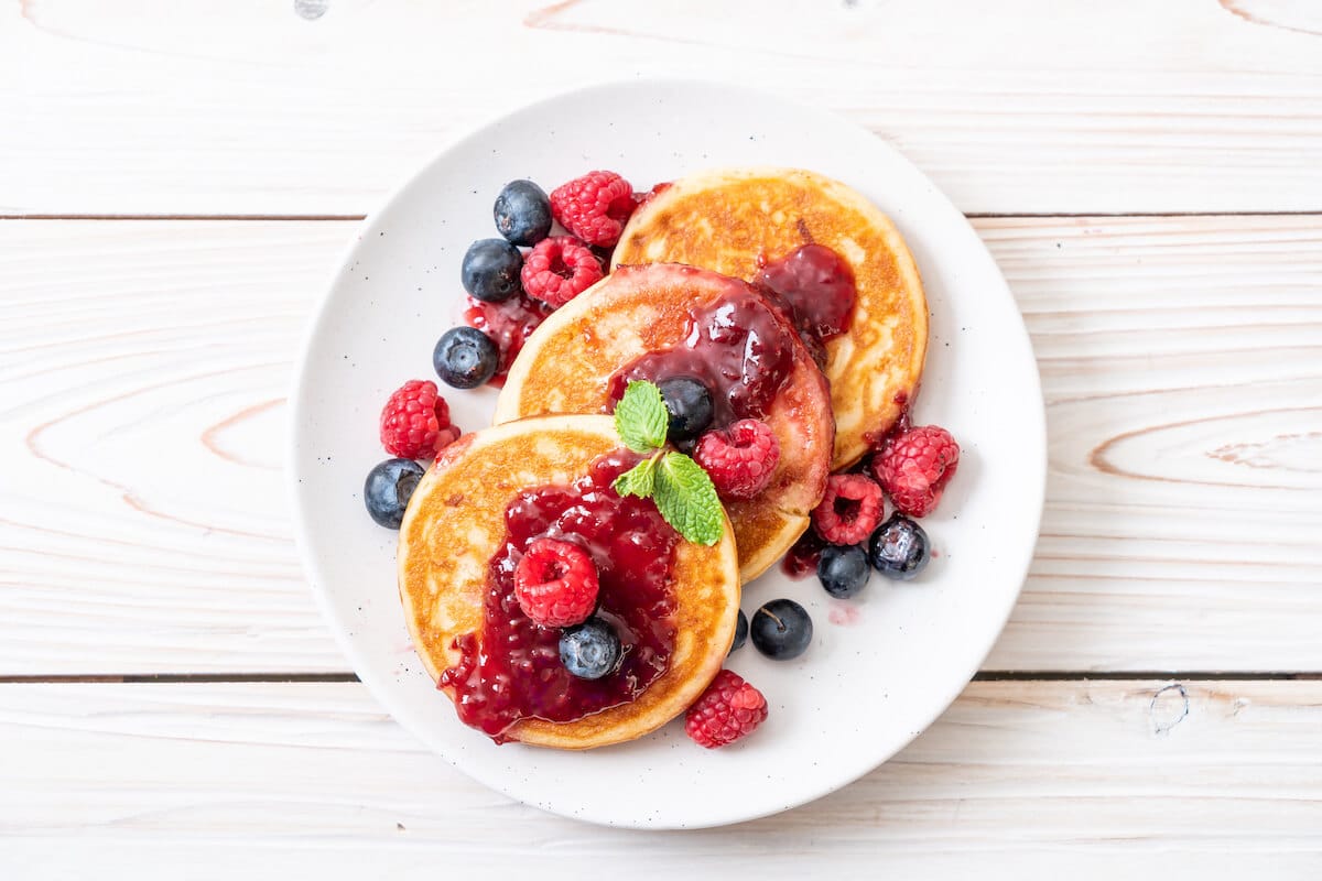High protein breakfast: protein pancakes with raspberries and blueberries